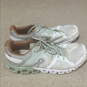 On Running White and Green Sneakers with Cloud Cushioning